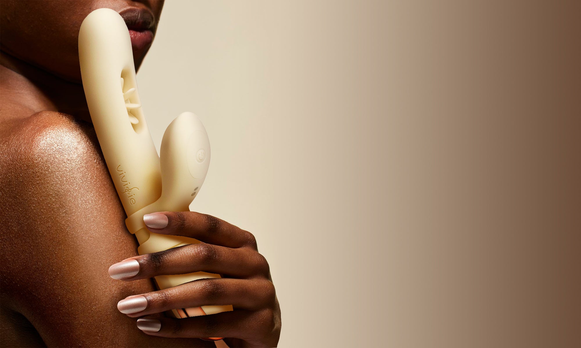 Woman_holding_VIVIFIE_VELORA_Rabbit_sex_toy_on_desktop_banner